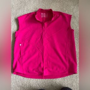 Hot pink Rafaela oversized two pocket FIGS scrub top.